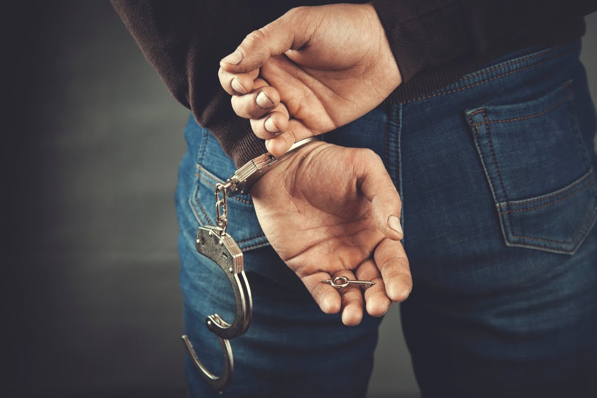 Freddie's Bail Bonds - Jacksonville, Florida A man with handcuffs on his hands seeks bail bonds in Jacksonville.